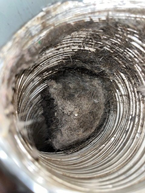 Healthy Home Services dryer vent cleaning equipment in use
